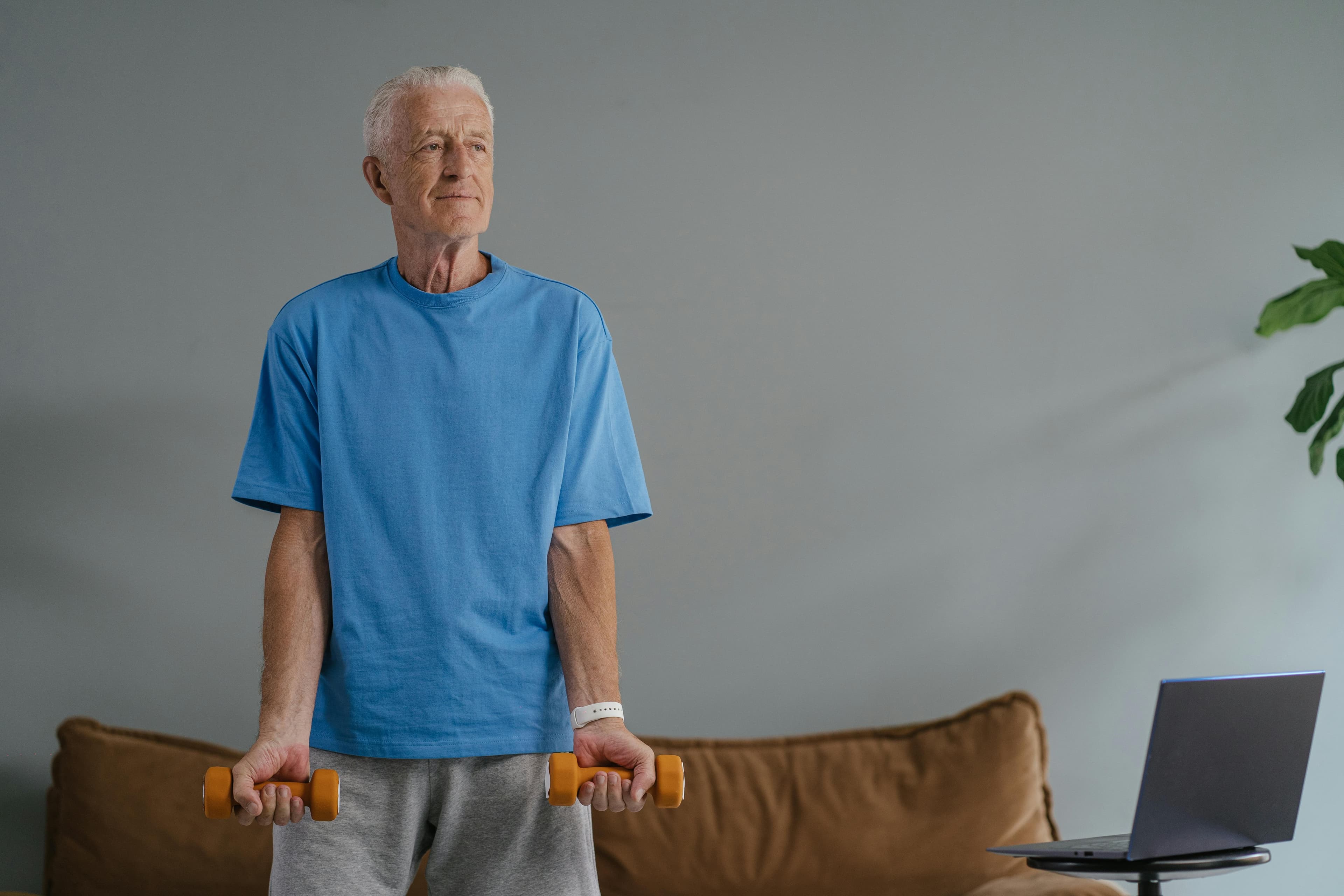 An older adult following a guided home exercise session